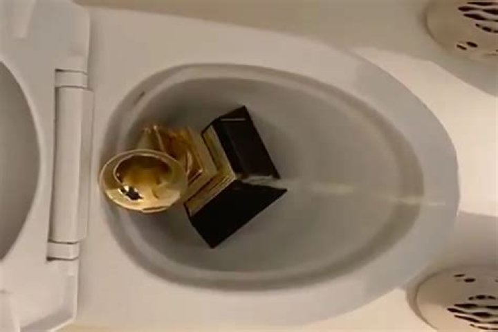 Kanye West Pees On His Grammy Award In Toilet Bowl